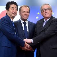 EU, Japan look to speed up talks on trade deal