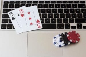 The Business of Gaming Regulation: The Ups and Downs of Legal Changes Online-Poker - Chips und Karten auf dem (CC BY 2.0) by marcoverch