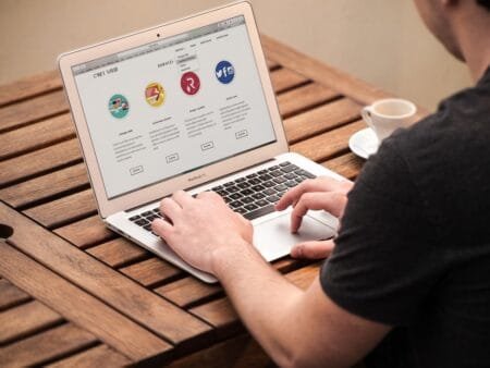 The Psychology Behind High-Performing Promotional Campaigns Playing on laptop