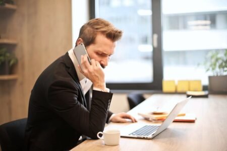 Business man on phone - Photo by Andrea Piacquadio on Pexels