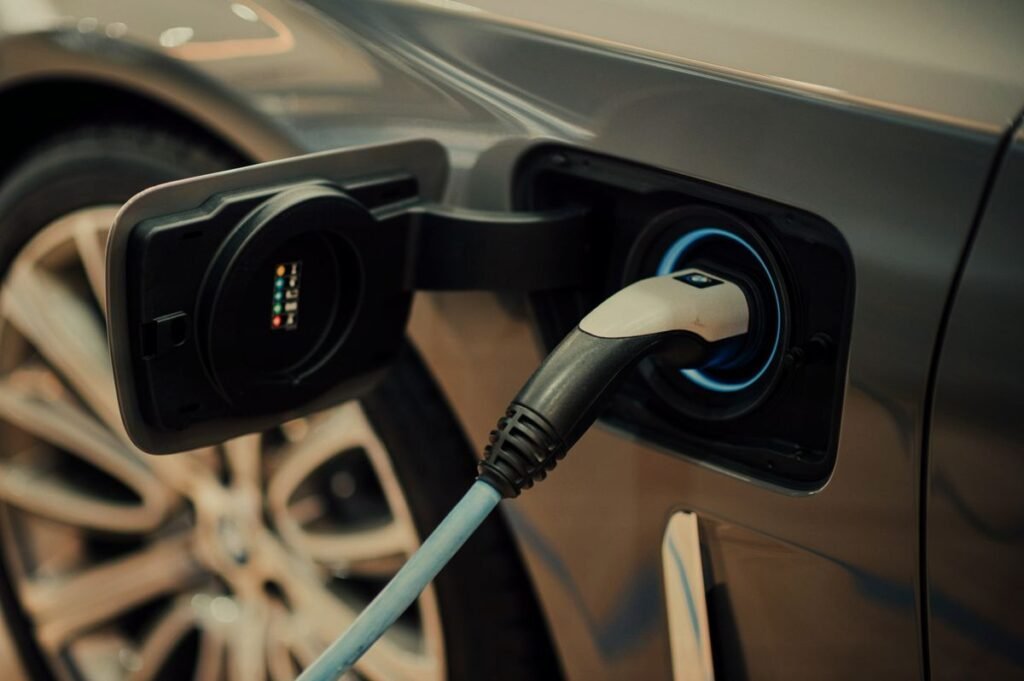 Electric car charging - Photo by CHUTTERSNAP on Unsplash