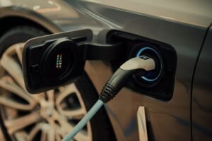 Electric car charging - Photo by CHUTTERSNAP on Unsplash