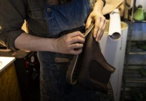 Shoemaker repairing used shoes - Photo Michael Campanella © European Union 2026