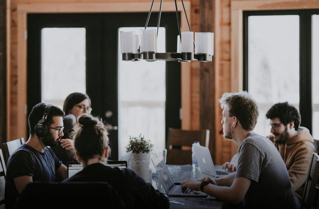 Business meeting with laptops - Image by Annie Spratt on Unsplash